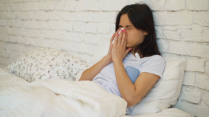 videoblocks girl is sitting on the bed she got sick this morning and wants to recover as soon as possible young woman will take some medicine to feel better later szvzjhr0f 1080 D